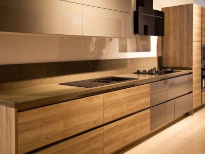 Interior of luxurious modern kitchen equipment, grey and oak cabinets